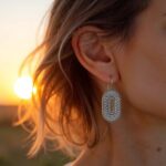 Silver Berber earrings with oxidized finish worn at sunset highlighting traditional oval craftsmanship