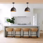 Two hammered dome lights over modern kitchen counter