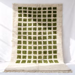 green grid pattern Moroccan rug with traditional fringe detail