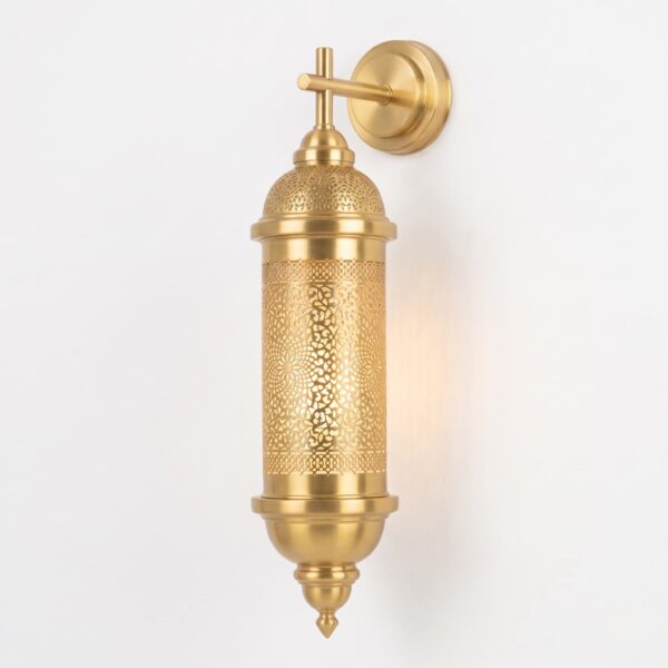 17.5 inch domed filigree brass wall sconce with hand-pierced Moroccan patterns glowing warm light, mounted on a white wall