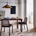 Brass cone pendant lights in contemporary dining setting