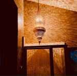 Brass pendant lamp shade in traditional interior setting