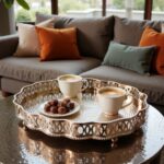 Hammered silver tray serving Moroccan coffee cups and traditional sweets