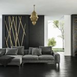 Large engraved brass pendant light 80cm hanging in contemporary living room with modern decor and gray sofa