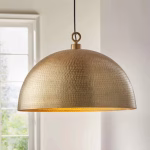 Gold dome pendant light in bright modern interior