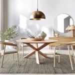 Gold dome pendant lights over modern dining table