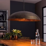 Hammered dome pendant light over dark kitchen counter
