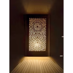 Illuminated square wall sconce creating dramatic floor lighting