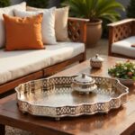 Hammered silver tray holding candles and coffee set in outdoor garden patio setting