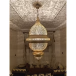 Ornate brass lampshade with intricate pattern detail