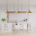 Three brass cone pendant lights illuminating modern kitchen island