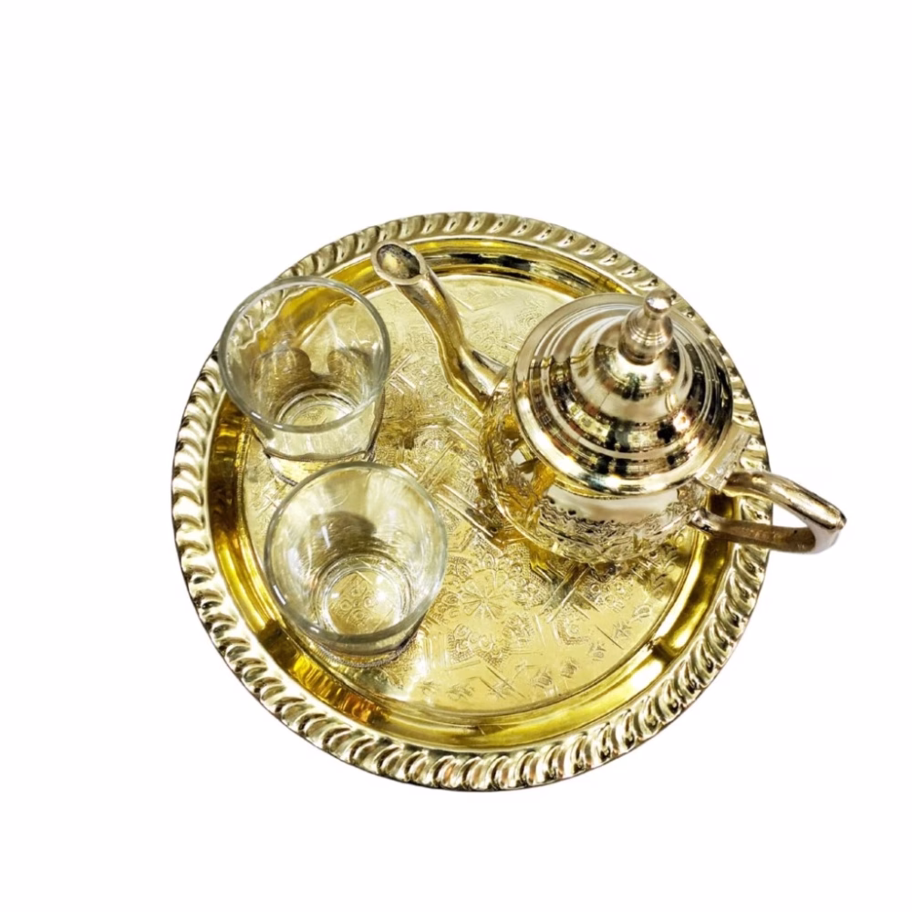Top view of brass mini tea set showing intricate pattern on serving tray
