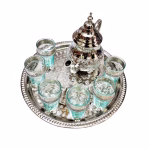 Traditional handcrafted Moroccan engraved tea set with intricate patterns on silver tray