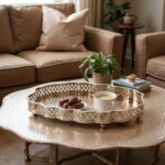 Hammered silver tray with intricate pierced filigree border on woven rattan table
