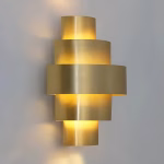 Wall-mounted brass light creating ambient lighting effect