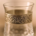 Close-up of textured handle on handmade glass cup