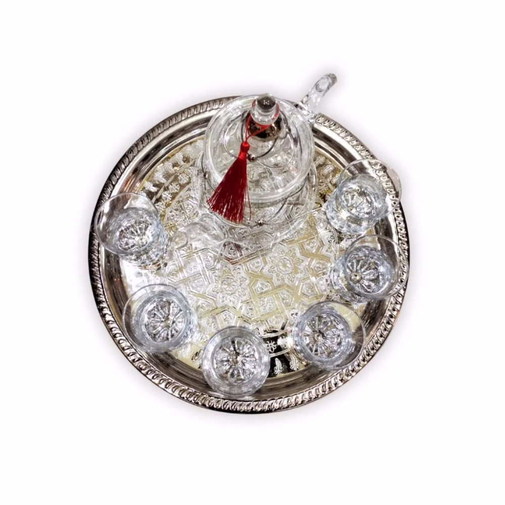 Ornate silver serving tray for Moroccan glass tea set with intricate hand-engraved details