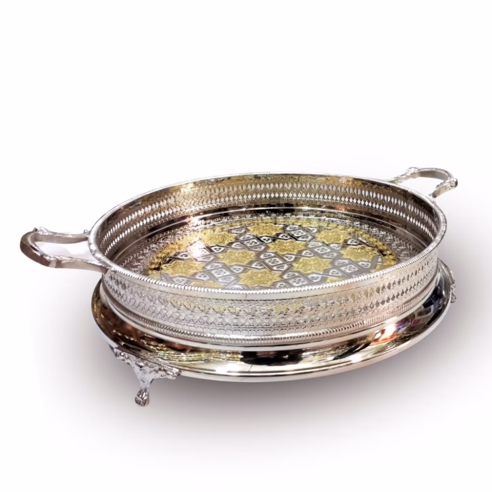 Hand-engraved silver and gold big round tray with decorative gallery rail and handles displayed at an angle