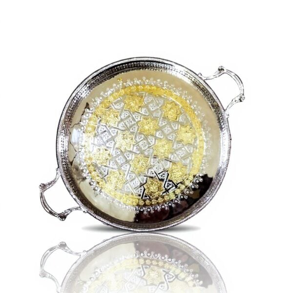 Overhead view of silver and gold big round tray showcasing intricate hand-engraved Moroccan geometric pattern