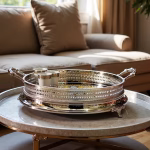 Silver big round tray with gold accents styled on marble coffee table with porcelain cups in living room