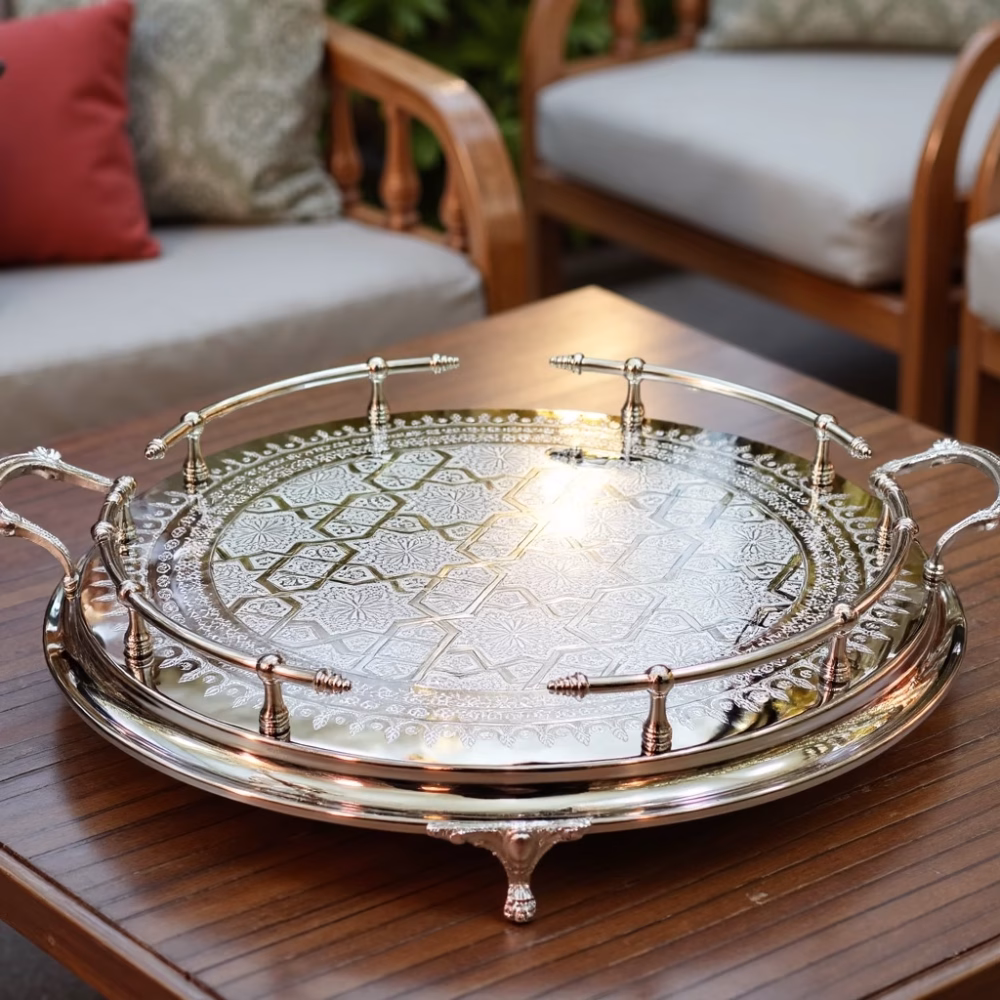 Silver large round tray with ornate gallery rail serving as stylish outdoor coffee table centerpiece