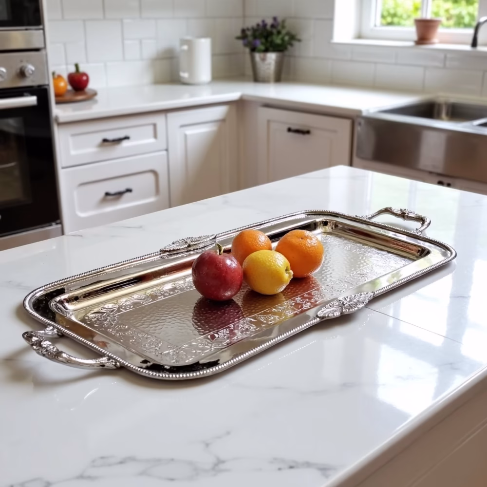 Handcrafted Moroccan silver rectangular decorative tray with fruits displayed on white marble kitchen island