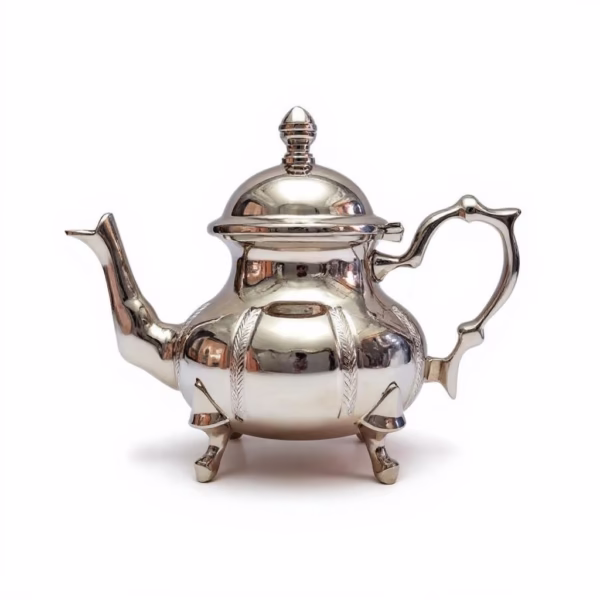 How to Clean Teapot: Complete Guide for Gift Care & Authentic Moroccan Tea Culture Studio shot of a gleaming silver Traditional Teapot with tripod feet, ornate handle, and curved spout against a pure white background.