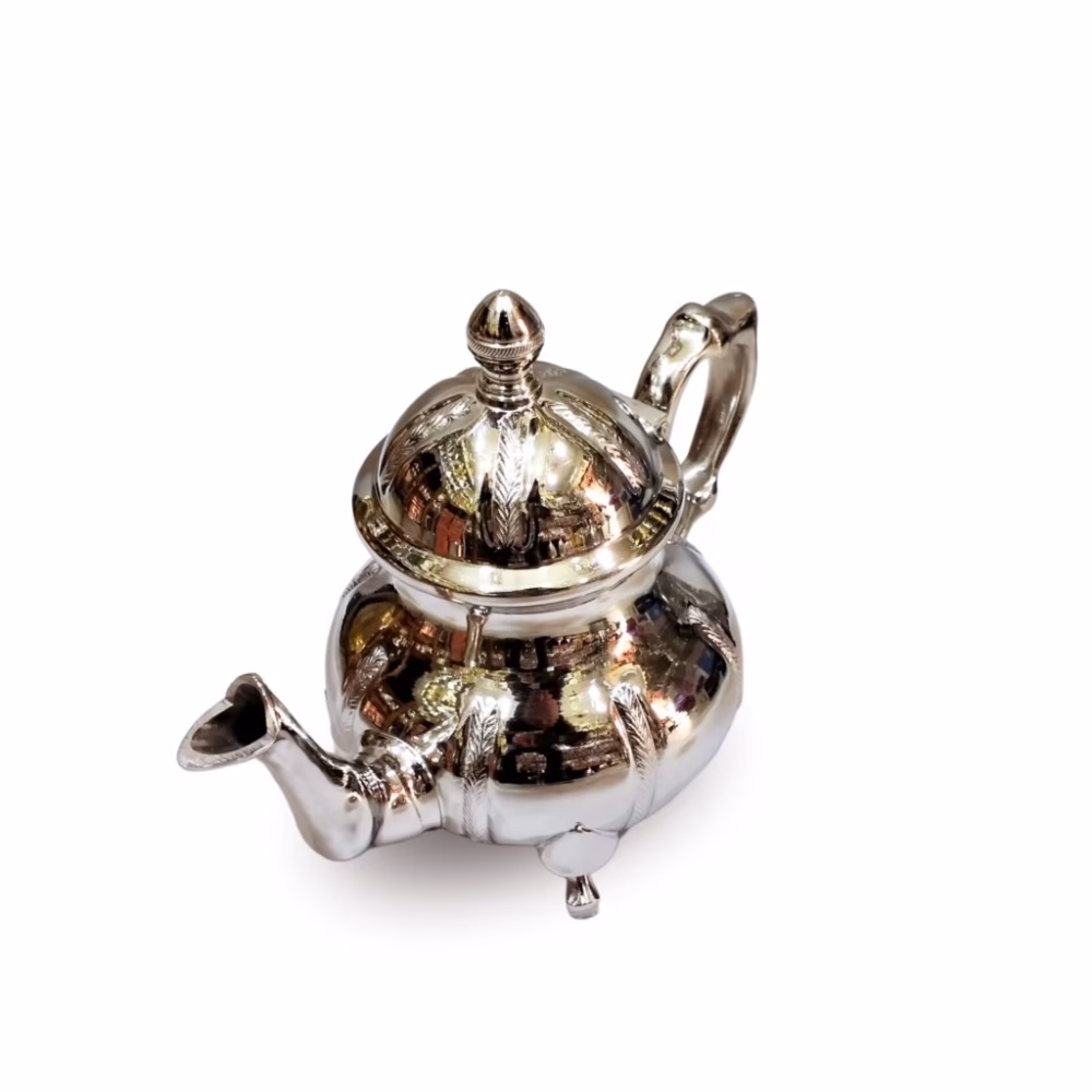 Traditional teapot with hand-engraved silver design and detailed spout
