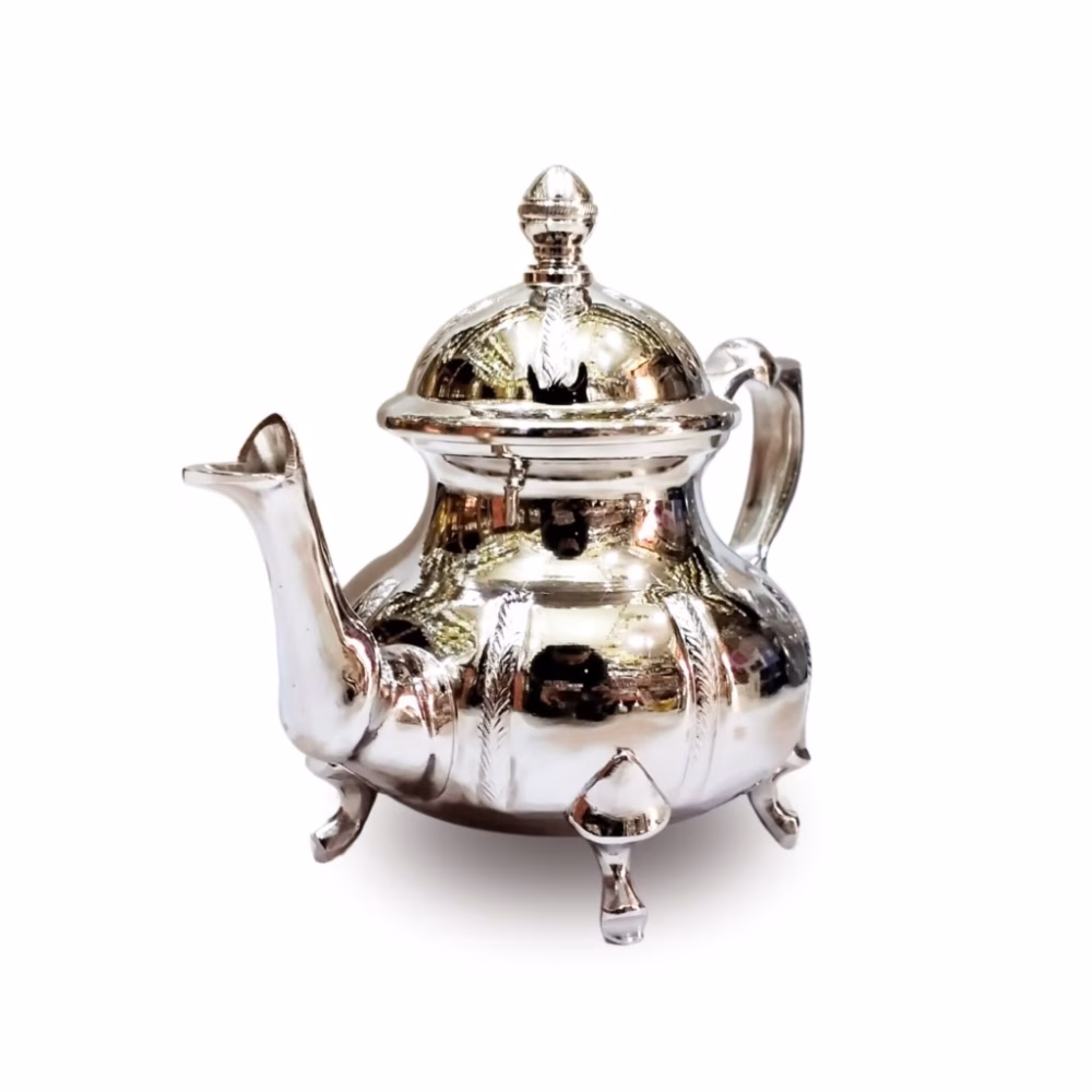Traditional teapot with intricate Moroccan feather design and four feet