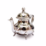 Traditional teapot with intricate Moroccan feather design and four feet