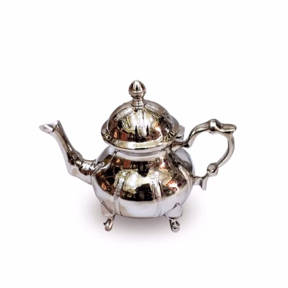 Traditional teapot with silver feather pattern engravings from Morocco