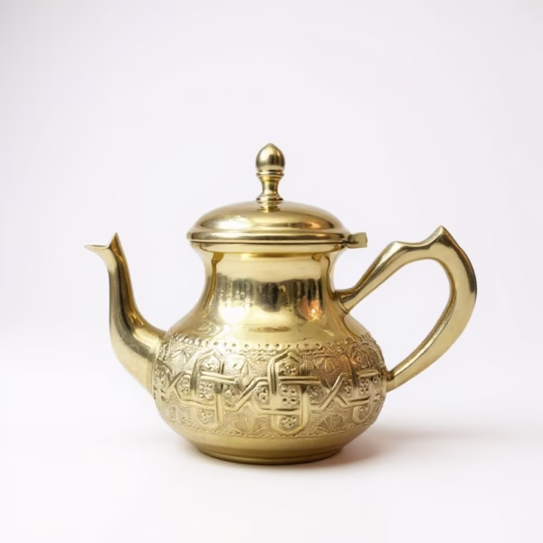 How to Clean Teapot: Complete Guide for Gift Care & Authentic Moroccan Tea Culture Close-up of hand-engraved gold teapot, showcasing intricate Moroccan patterns.