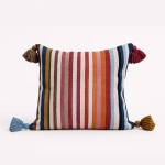 Multicolor striped outdoor cushion cover with coordinating corner tassels