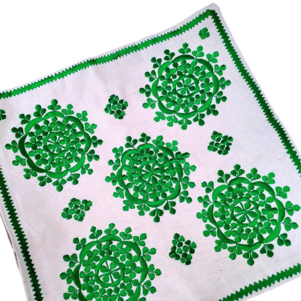 Set of green Moroccan embroidered sofa cushion covers on white background