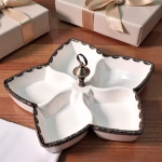 Artisanal ceramic dish with silver trim, viewed from the top