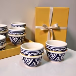 Blue-pattern espresso cups in yellow gift box tied with ivory ribbon—ideal for gifting.