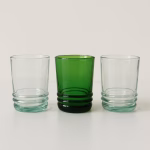 Lineup of three 4 oz Moroccan drinking glasses—clear, emerald, and clear—against white.
