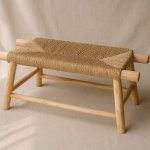 Handwoven straw bench showing palm leaf weaving detail and natural lemon wood frame construction
