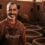 Omar the leather artisan standing beside terracotta vats, warm sun-beam, proud smile