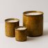 Handmade Tamegroute ceramic candles in three sizes with warm ochre glaze and natural plant-based wax