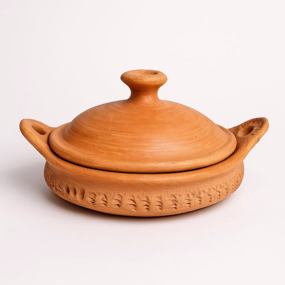 Studio shot of lidded 12 Marrakech tagine pottery against white background.