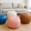 modern hero image featuring four Moroccan leather poufs in complementary colors