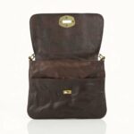 Interior view of leather crossbody bag showing zippered pocket and full-grain leather lining