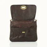 Interior view of leather crossbody bag showing zippered pocket and full-grain leather lining