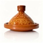 Hand-painted terracotta tagine pot with golden scrollwork patterns on conical lid, traditional ceramic clay cookware