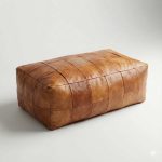 Full view of light brown Moroccan leather floor cushion on white background.
