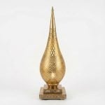 Teardrop brass floor lamp with hand-pierced diamond lattice pattern on square pedestal base against white background