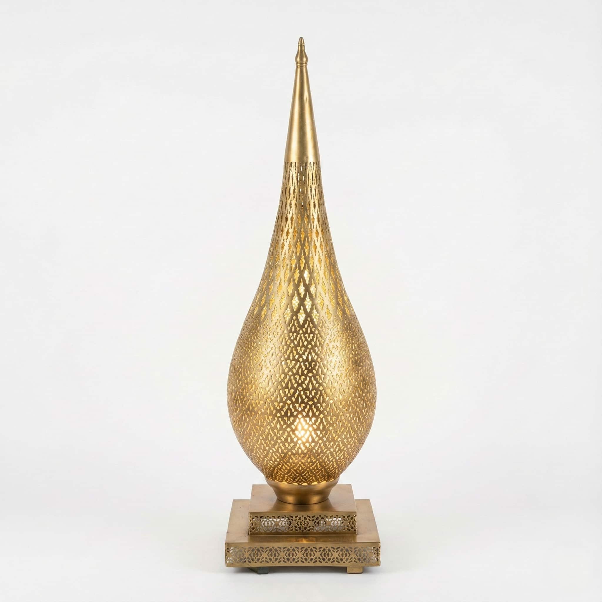 Hand-pierced brass floor lamp (1) Teardrop brass floor lamp with hand-pierced diamond lattice pattern on square pedestal base against white background