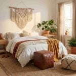Brown leather cube ottoman in bohemian bedroom with macrame wall hanging and neutral decor