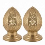 Set of two brass filigree table lamps with hand-pierced geometric patterns on polished round bases